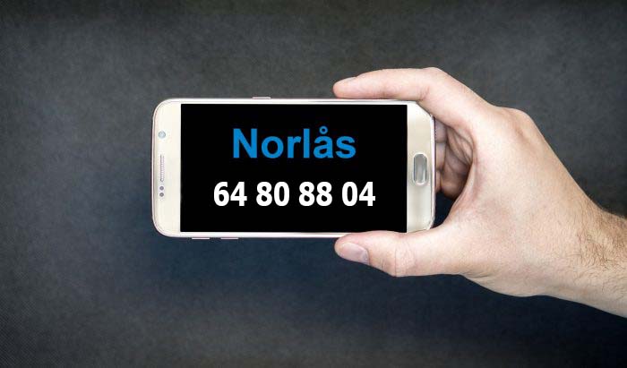 Telefon med telefonnummeret til Norlås 64808804